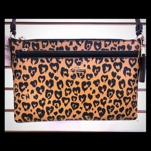 Coach Crossbody W/extra zippered pull out pouch.